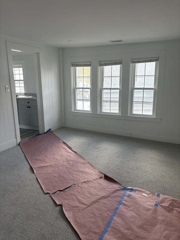34 Walnut Street, Unit 4 Natick, MA 01760 - Photo 4 of 16 an empty room with windows