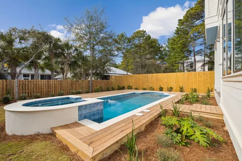 a view of a swimming pool with a lounge chairs