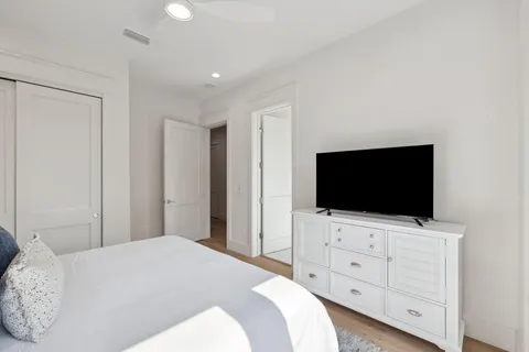 a bedroom with a large bed and a window