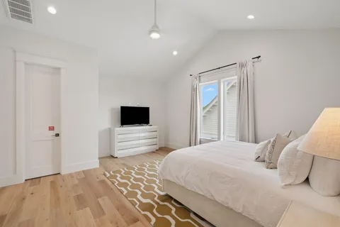 a bathroom with a double vanity sink and a window