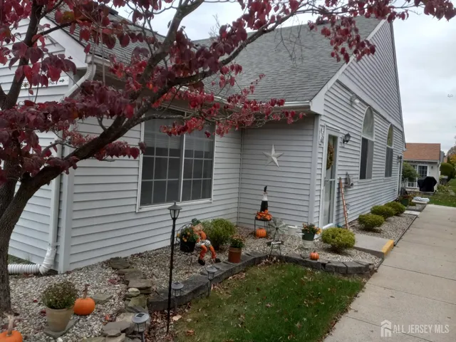 a backyard of a house with seating space