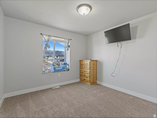 573 South Maxwell Drive Grantsville, UT 84029 - Photo 16 of 25 Unfurnished bedroom with carpet and baseboards