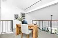 a bedroom with a bed and a large mirror