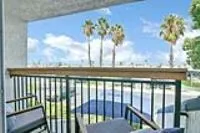 a view of balcony with furniture