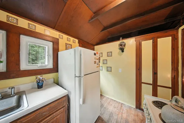 a white refrigerator freezer sitting in a kitchen