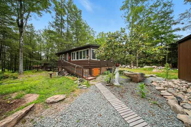 a view of a backyard with sitting area