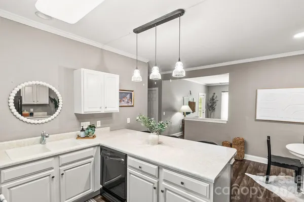 a bathroom with a sink a vanity and a mirror