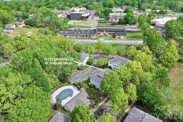 an aerial view of multiple house with outdoor space