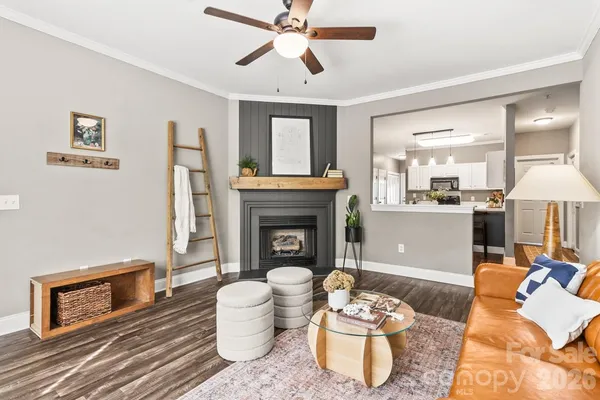 a living room with furniture and a fireplace