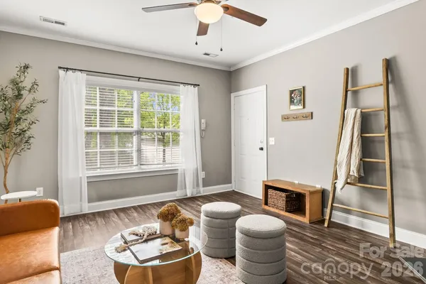 a living room with furniture and a window