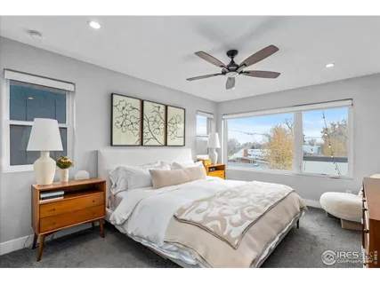 a bedroom with a bed and window