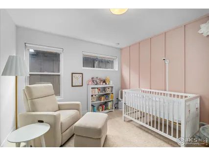 a bedroom with furniture and a book shelf