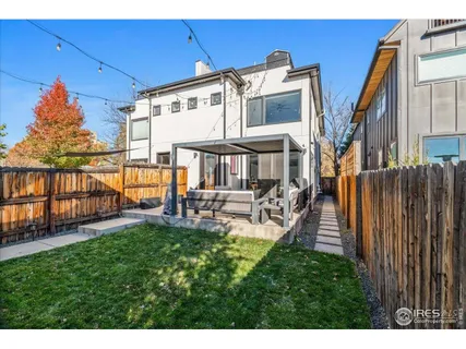 a view of a house with backyard porch and sitting area