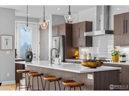 a kitchen with cabinets and refrigerator