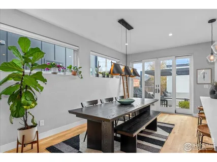 a room with furniture and a potted plant