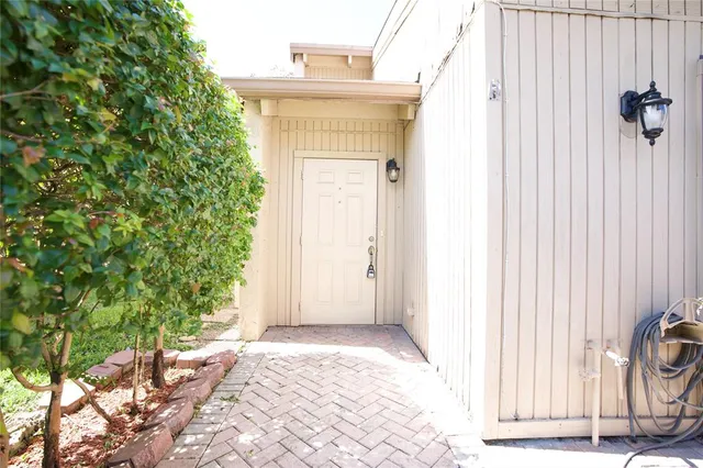 a view of a back yard from a corridor