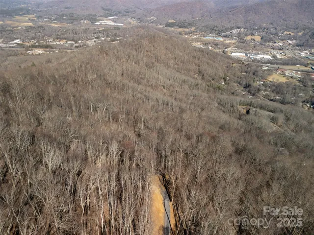 a view of mountain and a mountain in the distance