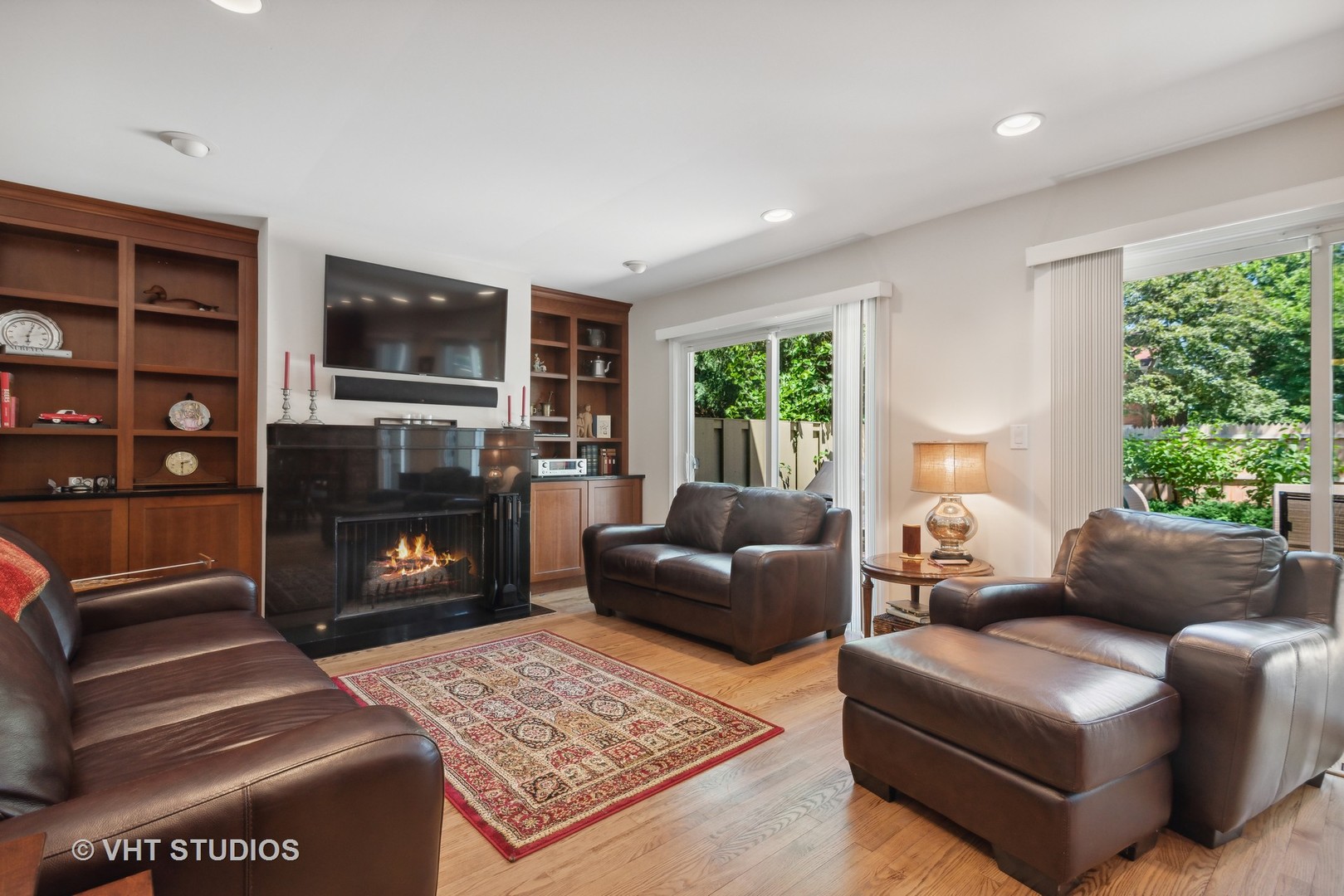 708 Gregg Road Northbrook, IL 60062 - Photo 17 of 43 a living room with furniture a flat screen tv and a fireplace