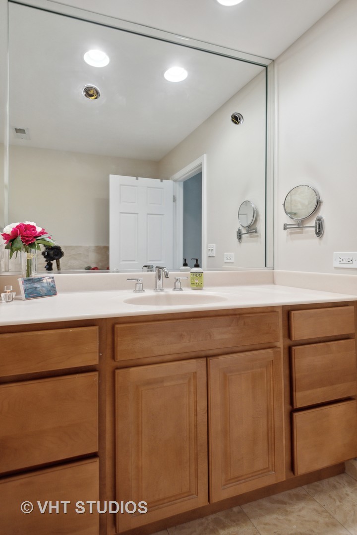 708 Gregg Road Northbrook, IL 60062 - Photo 29 of 43 a bathroom with a sink vanity and mirror