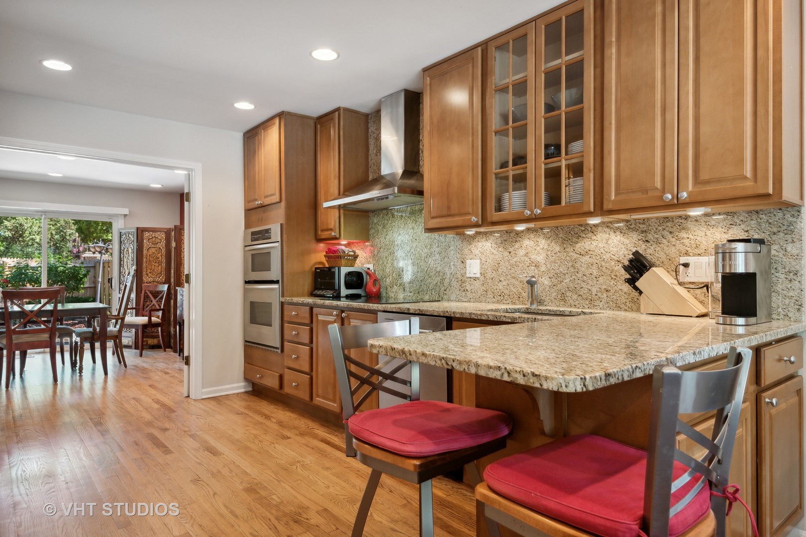708 Gregg Road Northbrook, IL 60062 - Photo 4 of 43 a kitchen with stainless steel appliances granite countertop a sink and a refrigerator