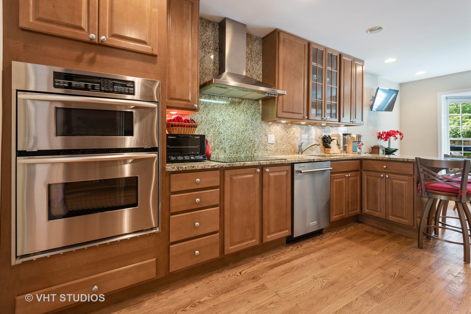 708 Gregg Road Northbrook, IL 60062 - Photo 5 of 43 a kitchen with stainless steel appliances kitchen island granite countertop a stove microwave and cabinets