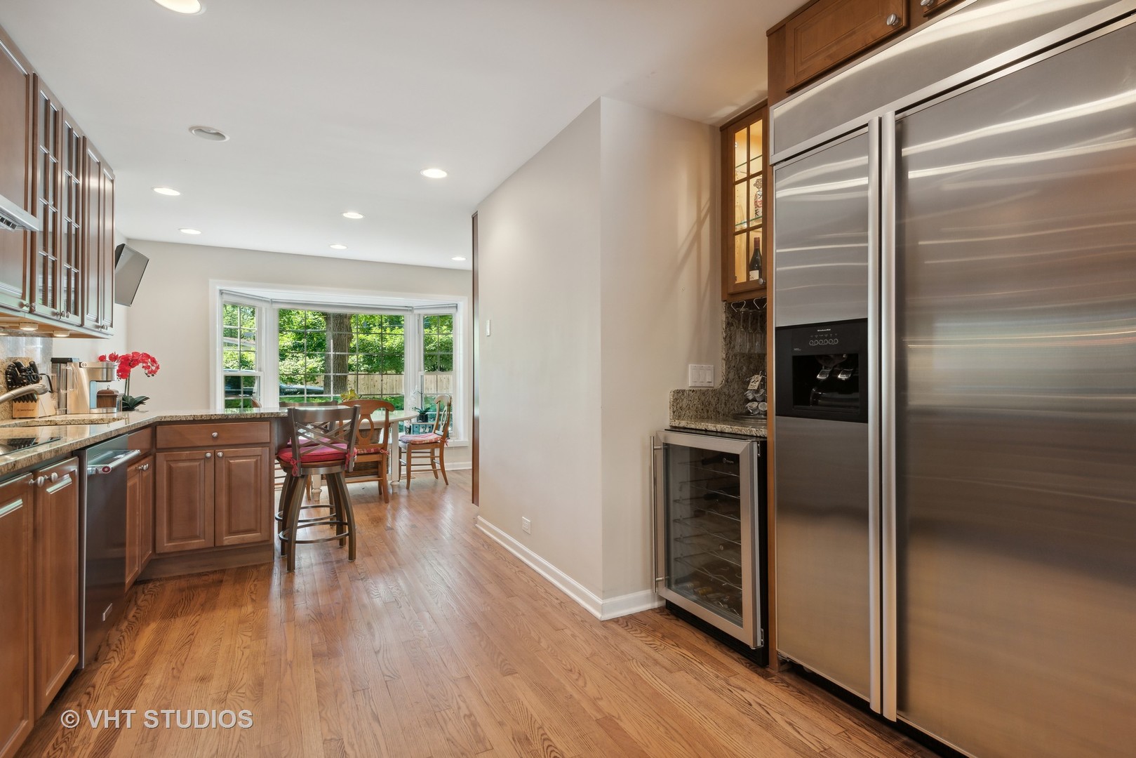 708 Gregg Road Northbrook, IL 60062 - Photo 7 of 43 a kitchen with a refrigerator and a table