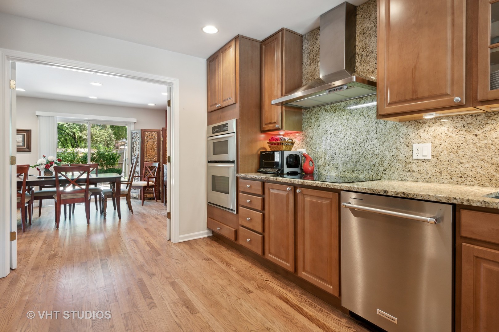 708 Gregg Road Northbrook, IL 60062 - Photo 9 of 43 a kitchen with stainless steel appliances granite countertop a stove and cabinets