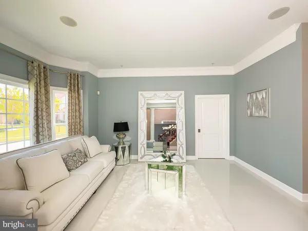 a bedroom with two beds and a chandelier