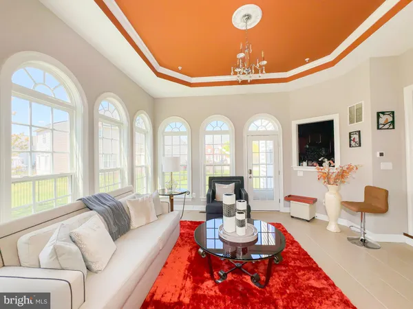 a view of walk in closet with windows