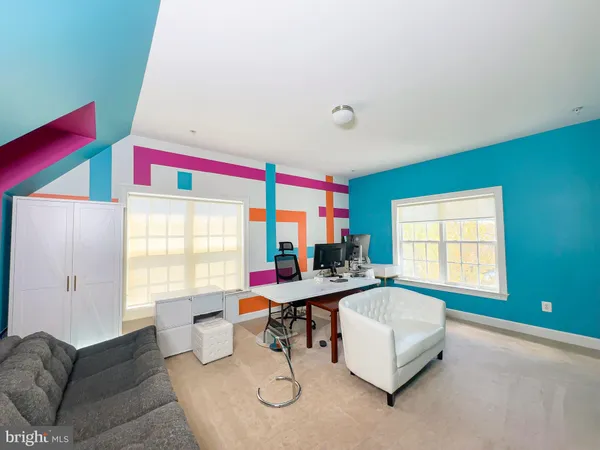 a room with furniture and air hockey table