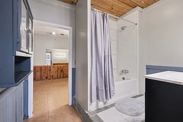 a view of a bathroom from the hallway