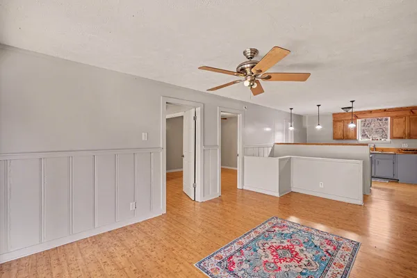 a living room with furniture and a rug