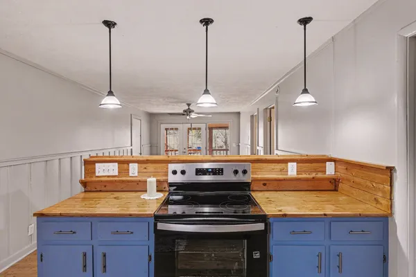 a kitchen with a stove and a sink