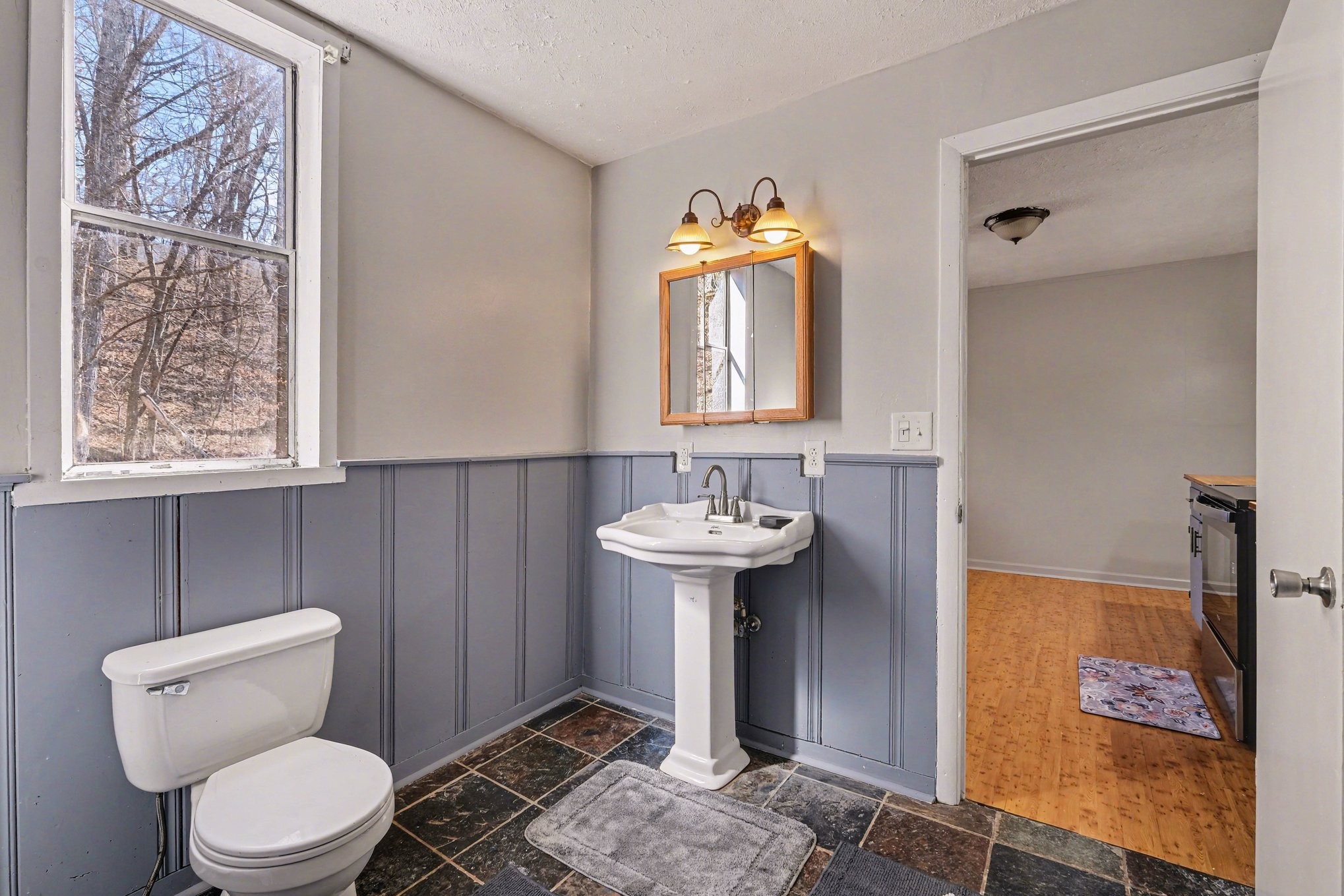 2650 Pretty Creek Road Nunnelly, TN 37137 - Photo 24 of 30 a bathroom with a toilet sink and mirror