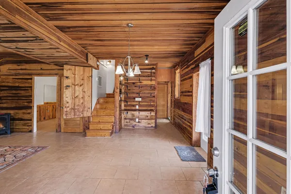 a view of empty room with white walls