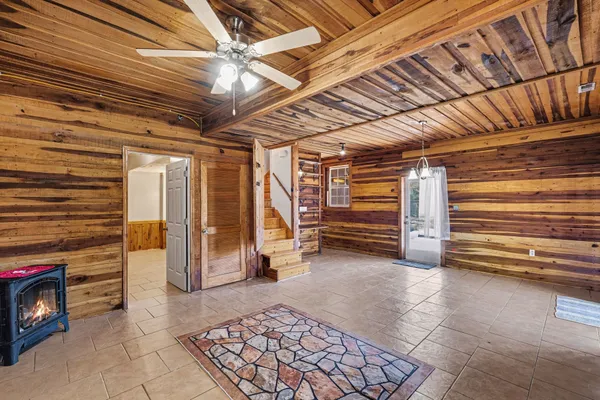 a view of an empty room with a ceiling fan
