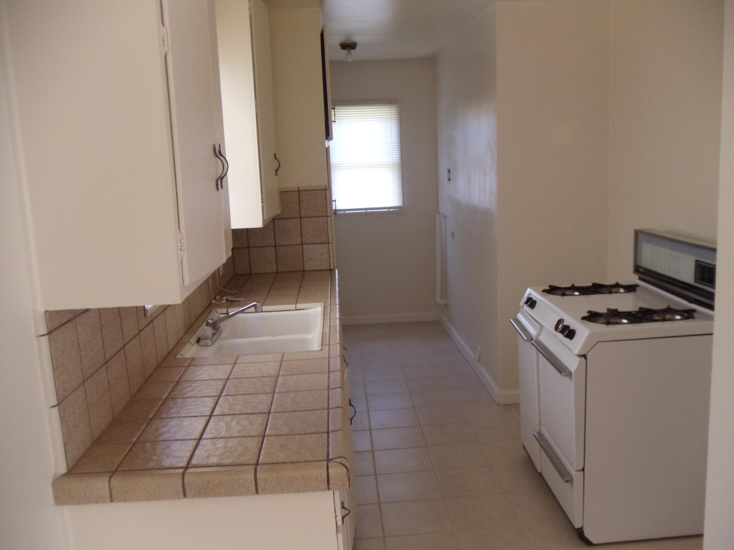 45153 Date Avenue Lancaster, CA 93534 - Photo 16 of 22 a kitchen with a stove