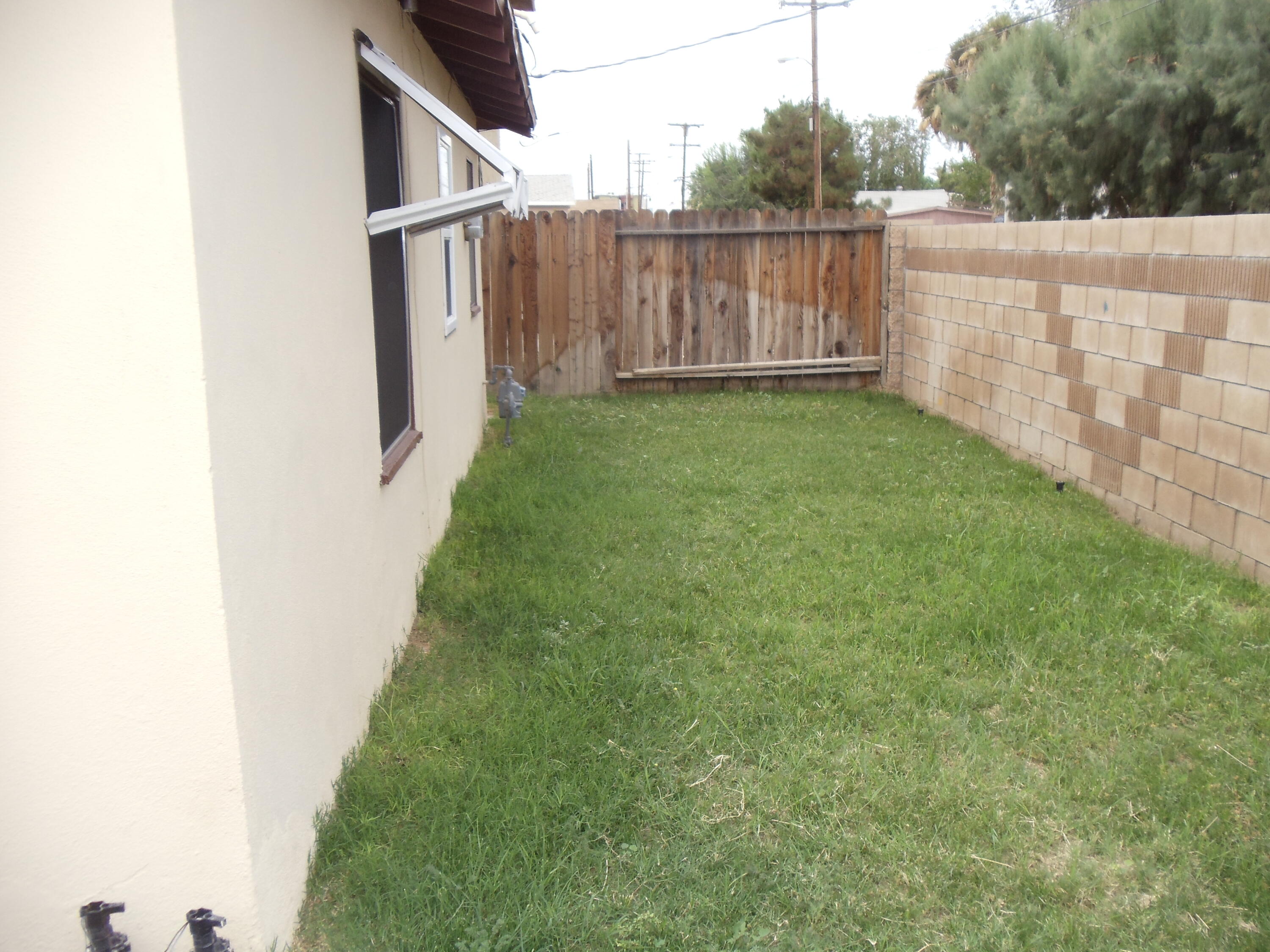 45153 Date Avenue Lancaster, CA 93534 - Photo 22 of 22 a view of a backyard with wooden fence