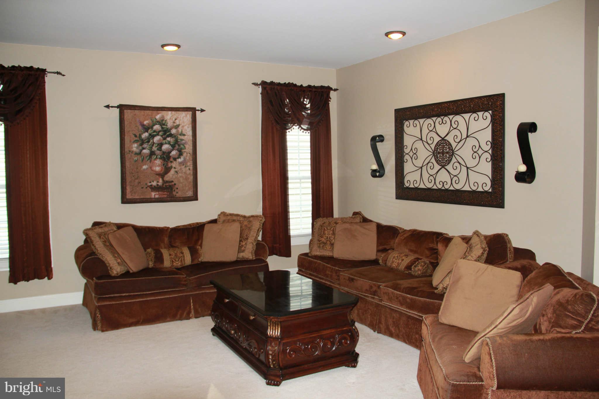 10809 Catron Road Perry Hall, MD 21128 - Photo 12 of 30 a living room with furniture and a painting