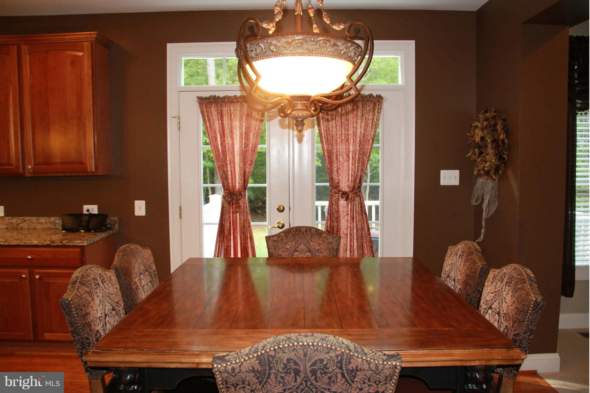 10809 Catron Road Perry Hall, MD 21128 - Photo 15 of 30 a living room with furniture and a chandelier