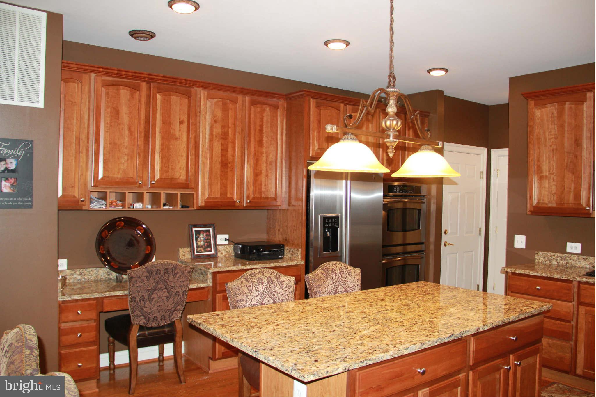 10809 Catron Road Perry Hall, MD 21128 - Photo 16 of 30 a kitchen with stainless steel appliances granite countertop a sink refrigerator and cabinets