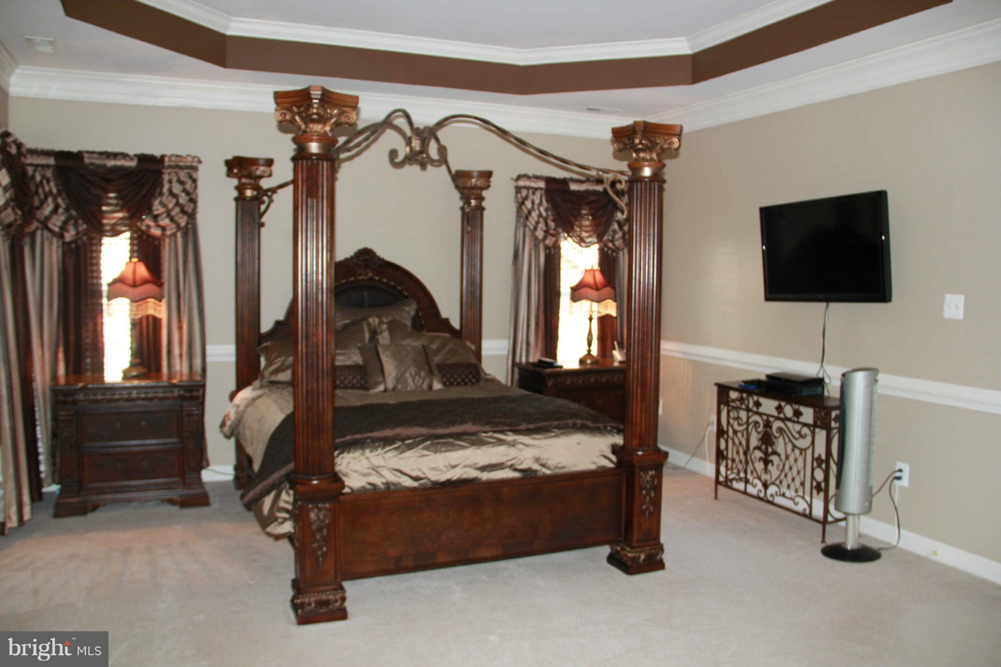10809 Catron Road Perry Hall, MD 21128 - Photo 19 of 30 a bedroom with furniture a flat tv screen and a dresser