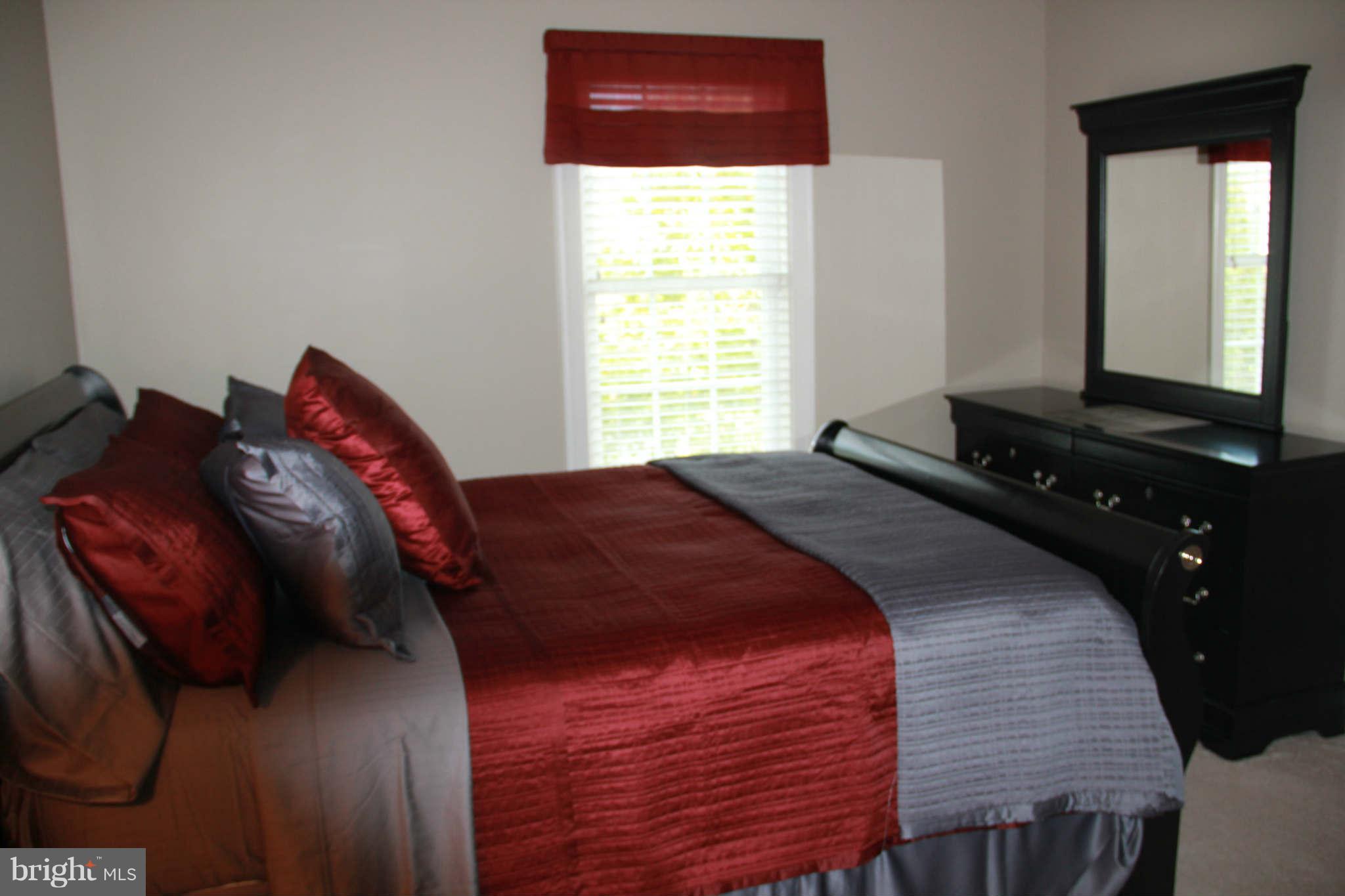 10809 Catron Road Perry Hall, MD 21128 - Photo 24 of 30 a bedroom with a bed and a window