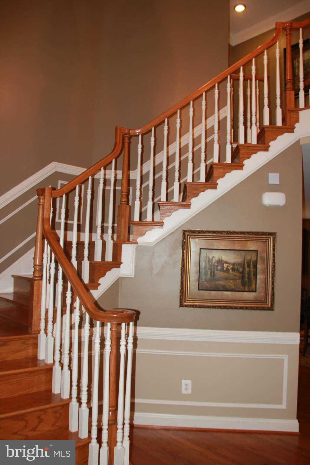 10809 Catron Road Perry Hall, MD 21128 - Photo 6 of 30 a view of staircase with wooden floor and a window