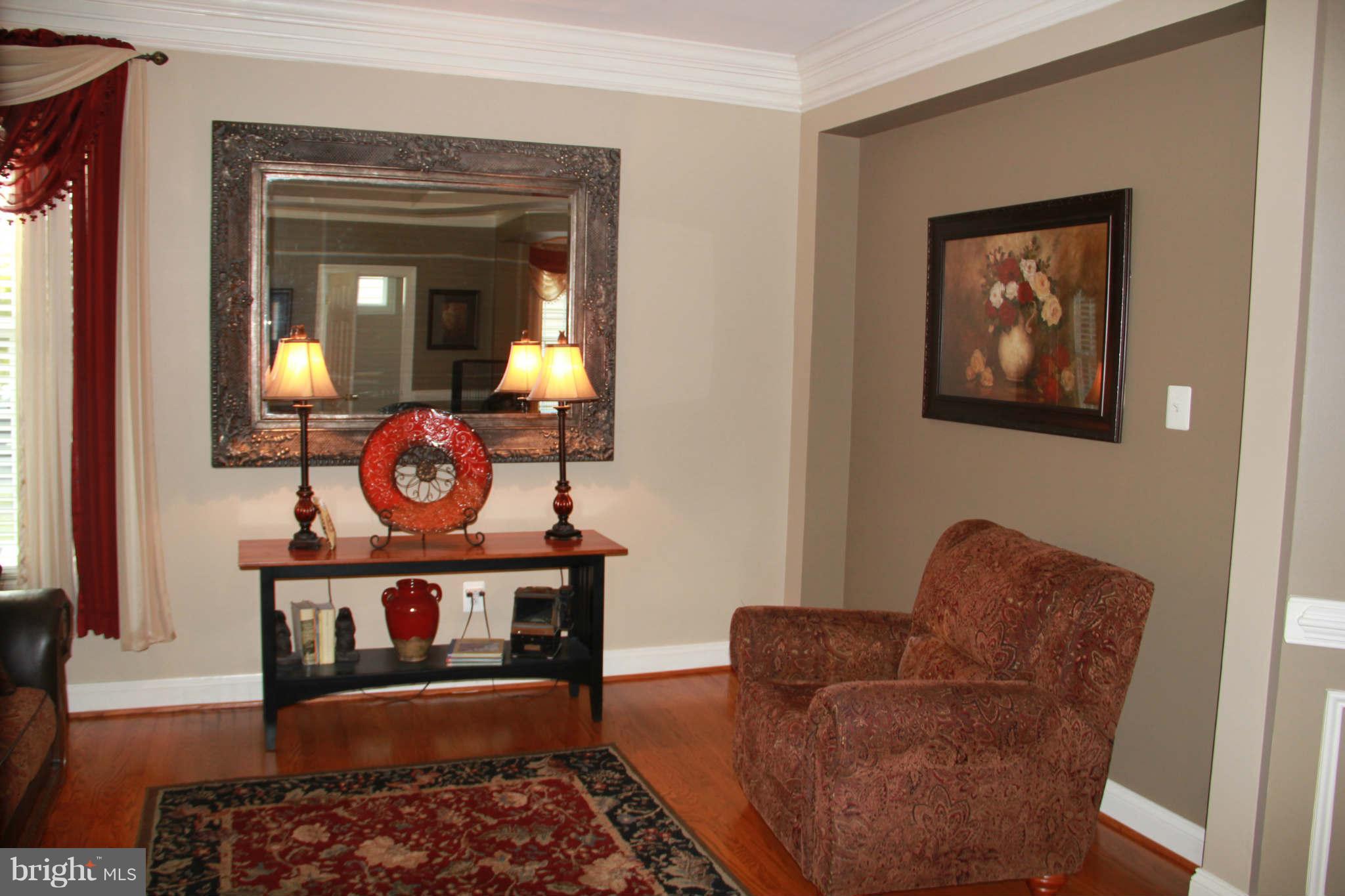 10809 Catron Road Perry Hall, MD 21128 - Photo 8 of 30 a living room with furniture and a wooden floor