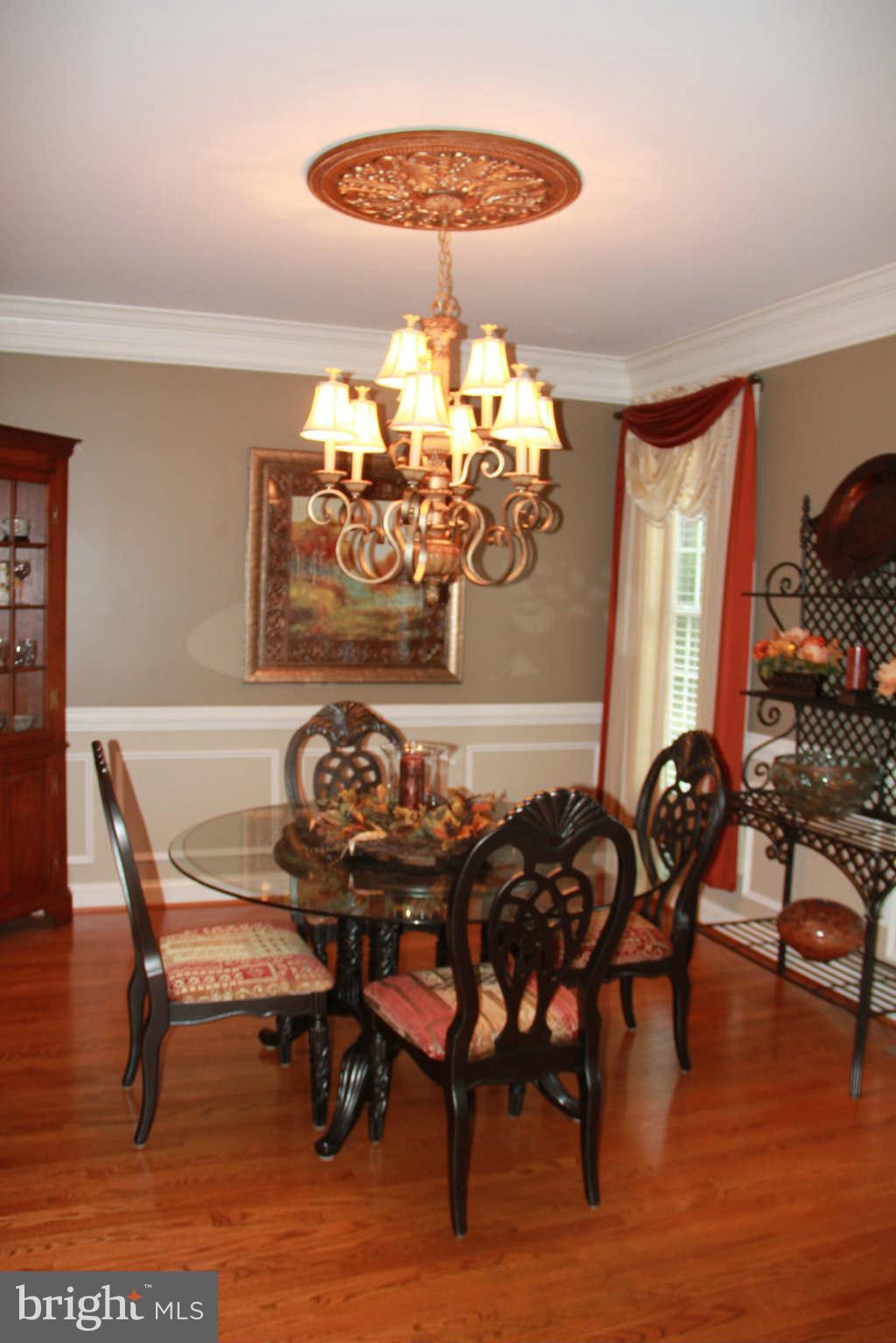 10809 Catron Road Perry Hall, MD 21128 - Photo 10 of 30 a view of a dining room with furniture and chandelier