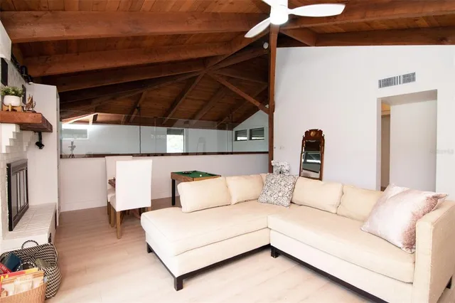 a bedroom with a bed and a potted plant
