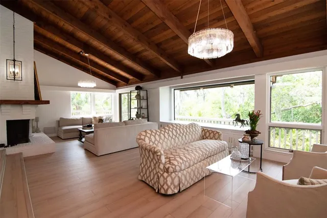 a view of balcony with wooden floor and outdoor seating