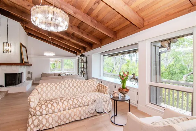 a view of a porch with furniture and wooden deck