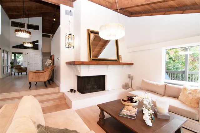 a dining room with furniture wooden floor and a rug